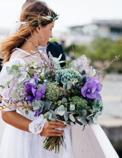Shabby Chic Bride holding wedding bouquet at contemporary wedding