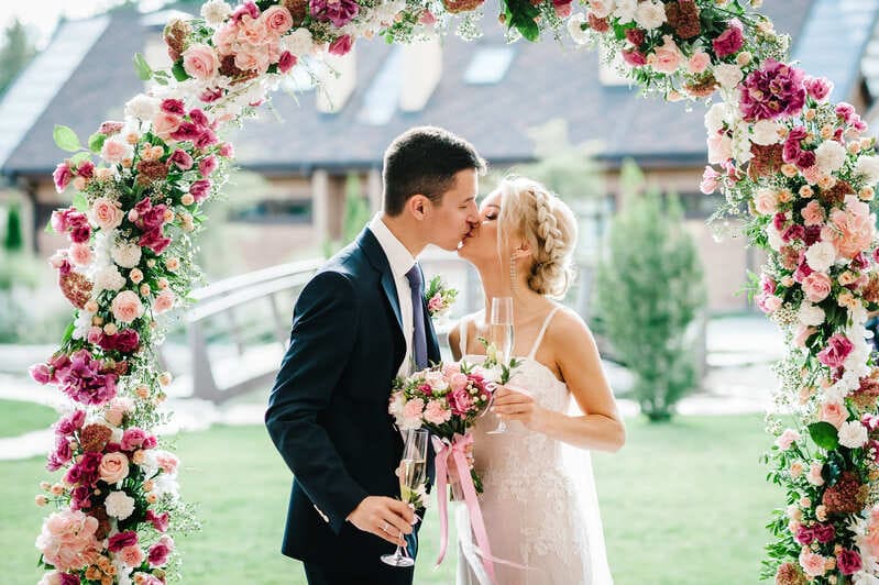 Rustic Wedding Bride and Groom Rustic Wedding Bride and Groom under floral arch